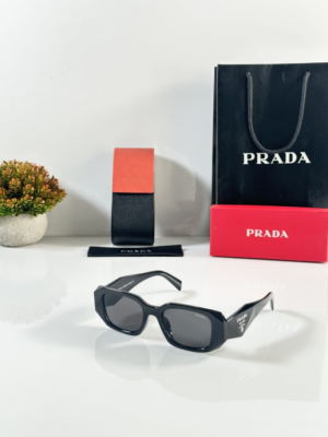 Prada 8679 Black Sunglasses with dark lenses and angular geometric frame