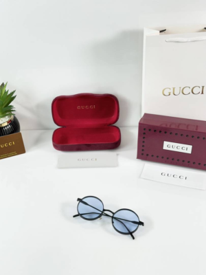 Gucci 001 Black Blue Sunglasses with round blue-tinted lenses and black frame