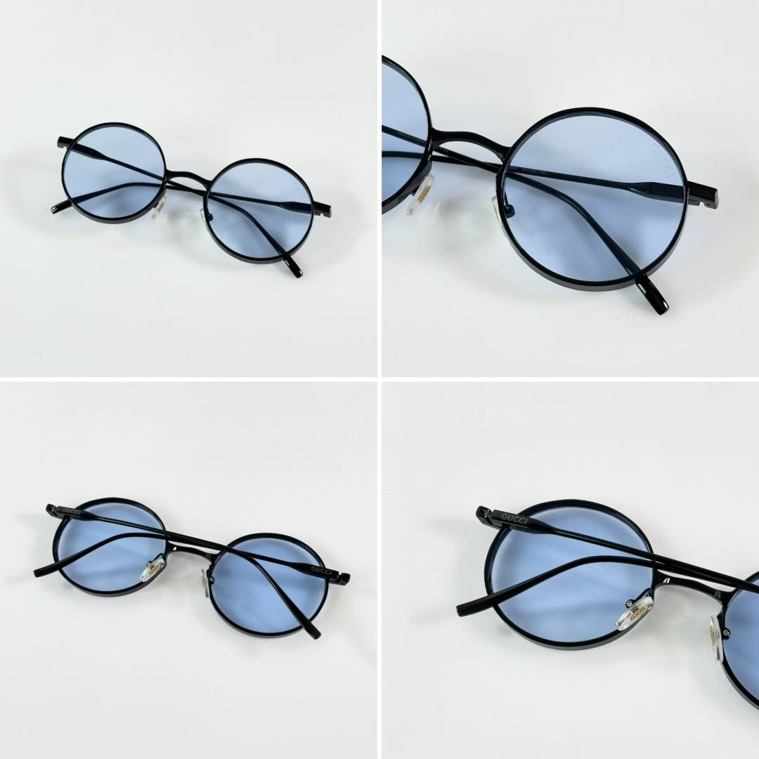 164 Gucci 001 Black Blue Sunglasses with round blue-tinted lenses and black frame