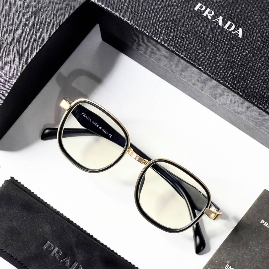 19 Prada 7382 Gold Plano Glasses with black and gold geometric frame