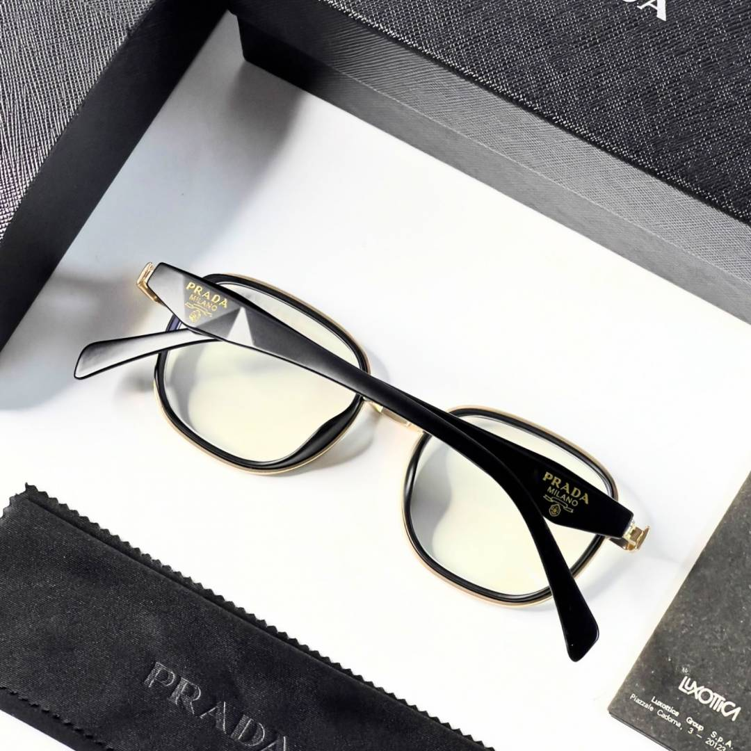 20 Prada 7382 Gold Plano Glasses with black and gold geometric frame