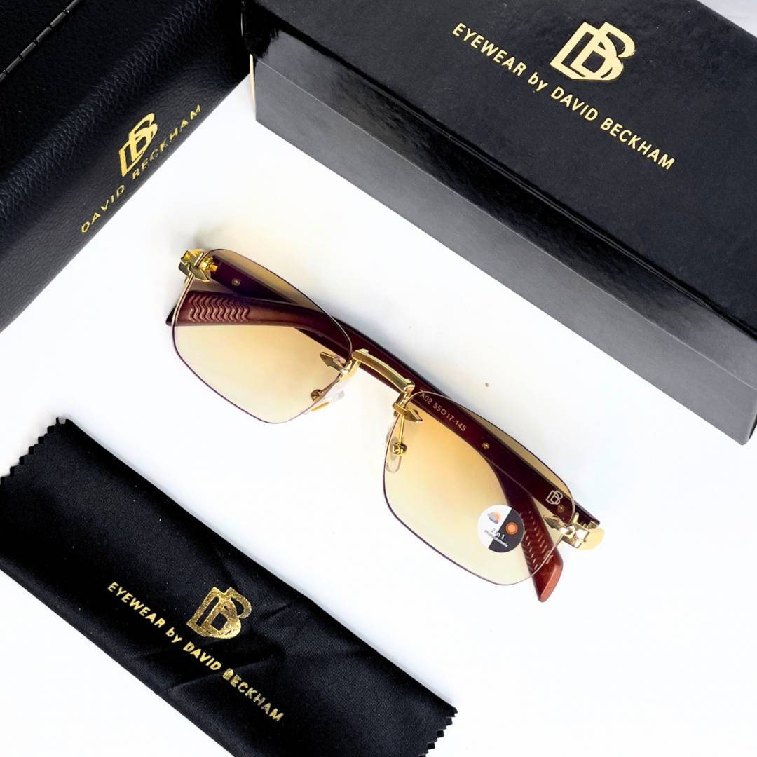 25 David Beckham 202 Gold Brown Sunglasses with rimless rectangular lenses