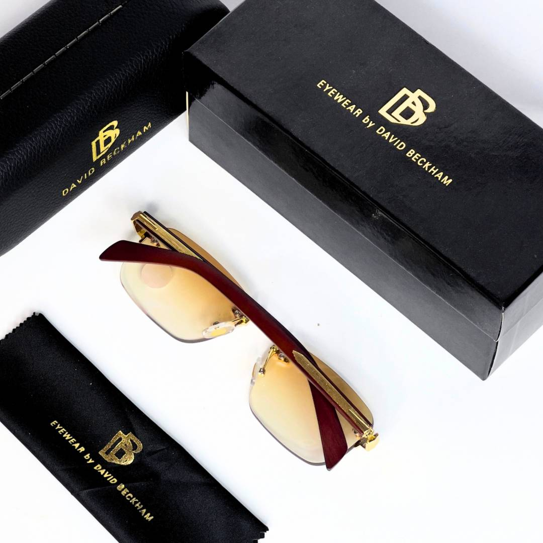 26 David Beckham 202 Gold Brown Sunglasses with rimless rectangular lenses