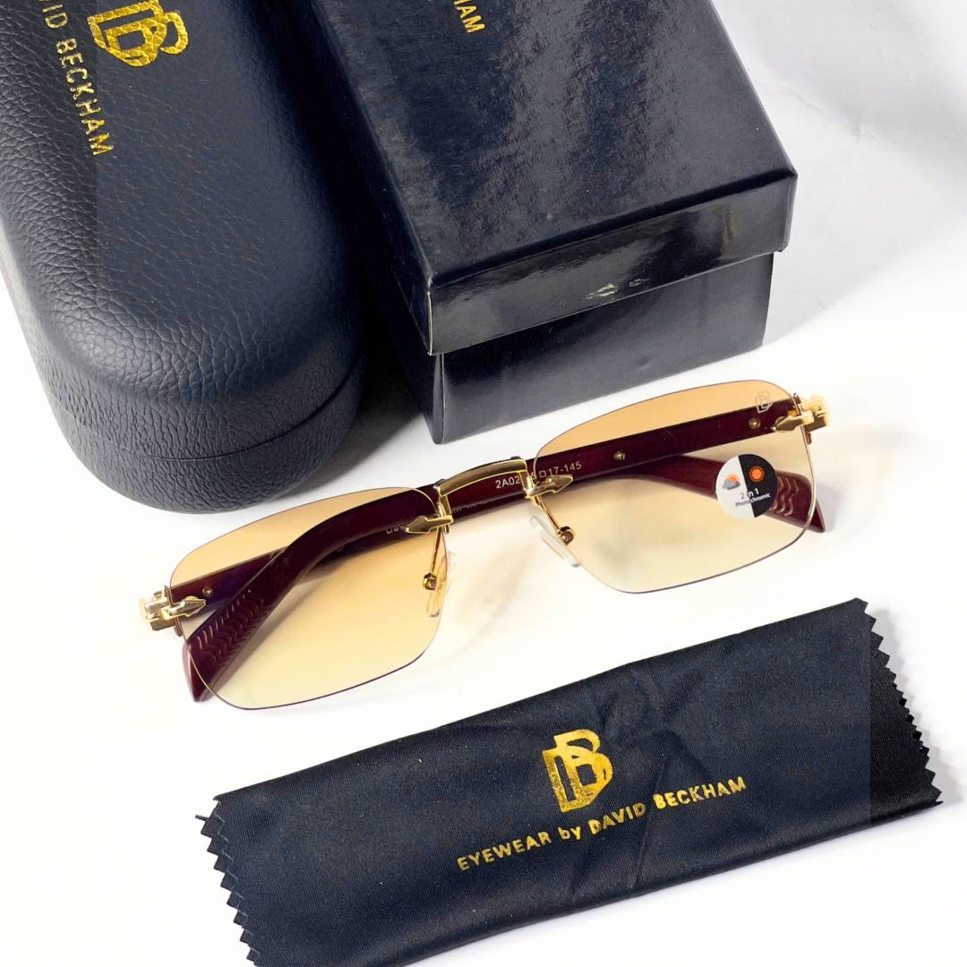 27 David Beckham 202 Gold Brown Sunglasses with rimless rectangular lenses