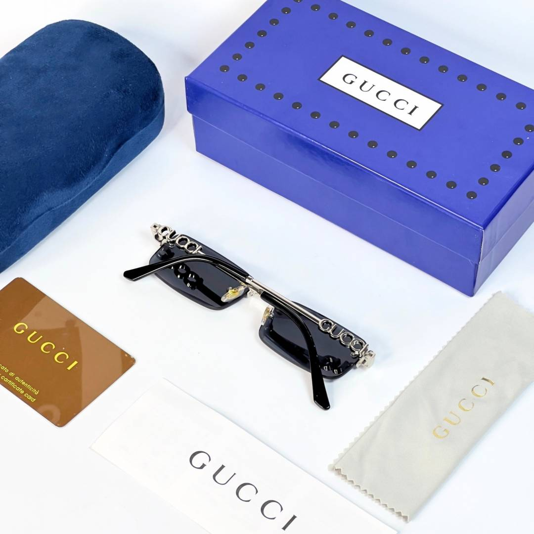41 Gucci 59011 Silver Black rimless sunglasses with rectangular dark lenses