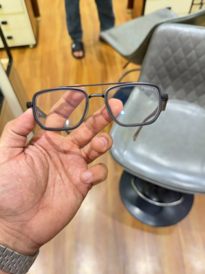 Prada 7384 Grey Plano Glasses with rectangular frame and clear lenses