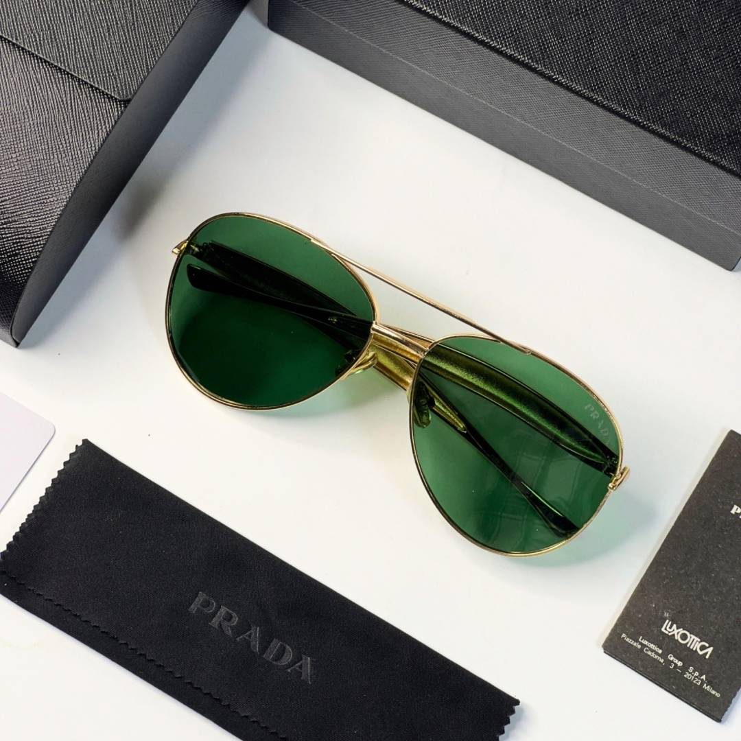 63 Prada 25008 Gold Green Sunglasses with aviator-style gold frame and green lenses