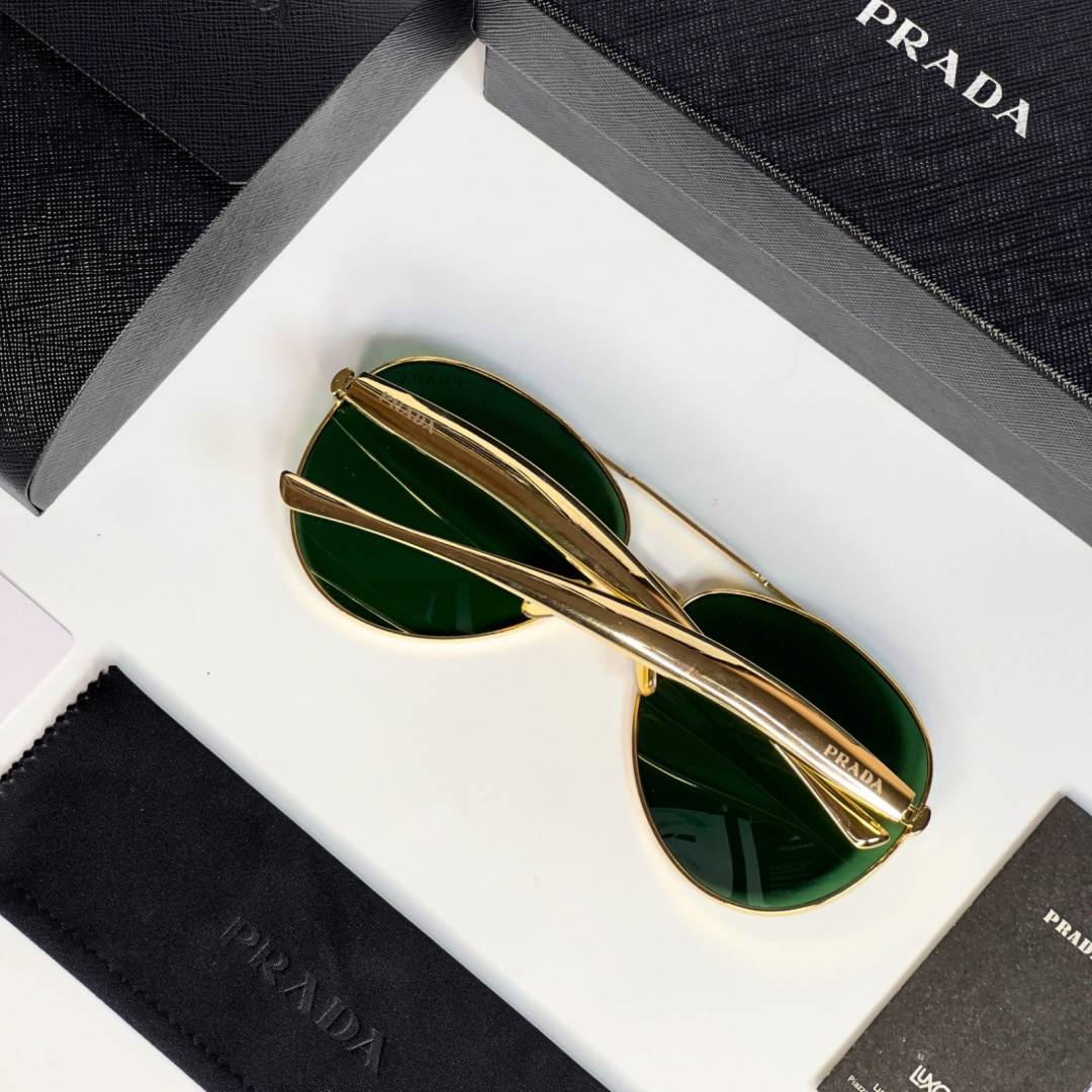 64 Prada 25008 Gold Green Sunglasses with aviator-style gold frame and green lenses