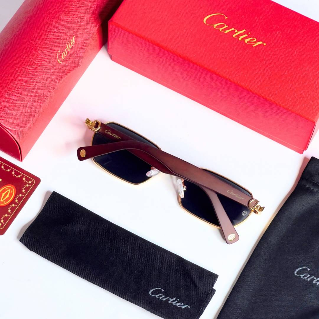 78 Cartier 704 Gold Black Sunglasses with geometric dark lenses and gold-tone frame