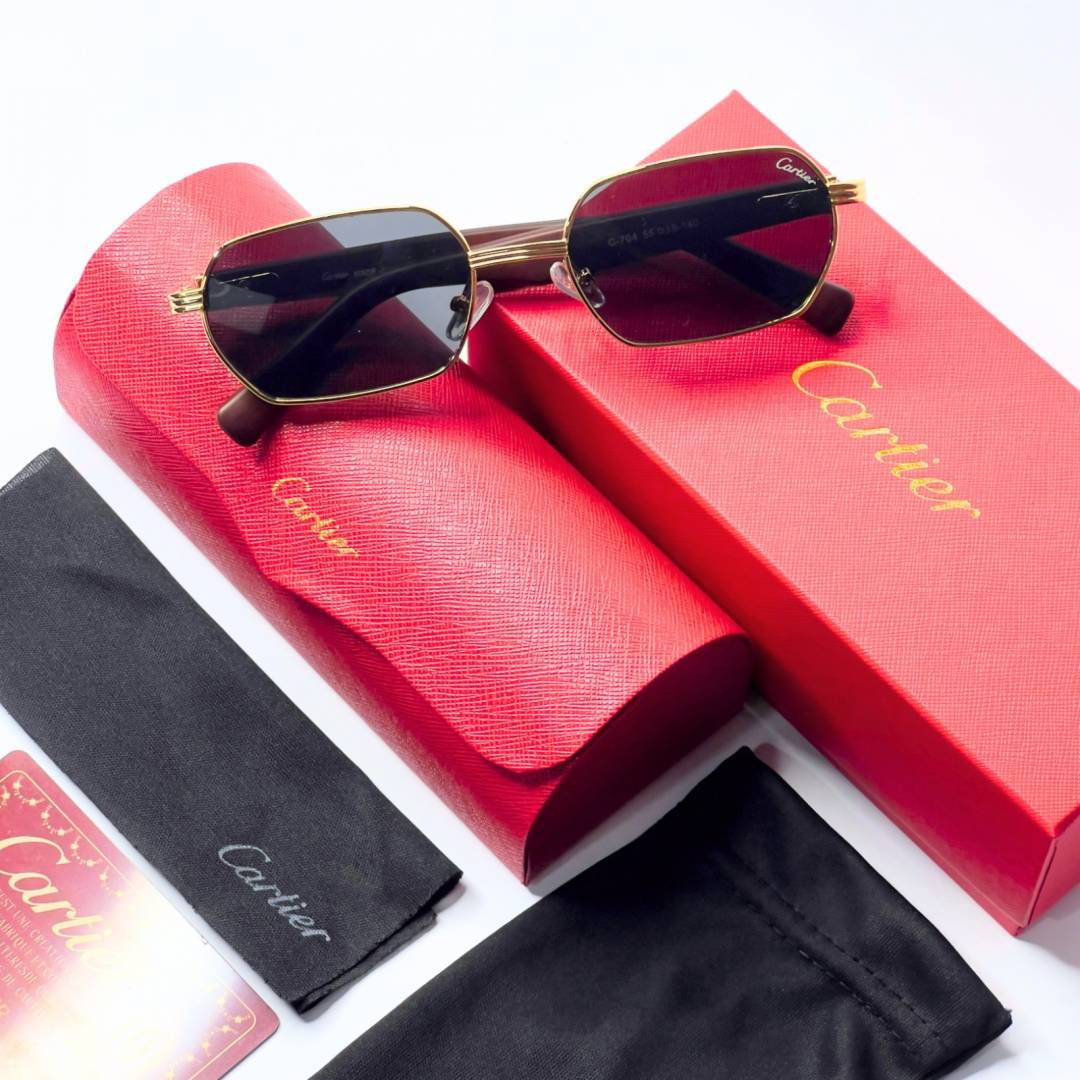 79 Cartier 704 Gold Black Sunglasses with geometric dark lenses and gold-tone frame