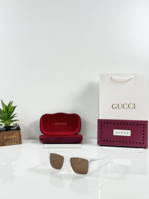 Guccii 2417 Ice Brown sunglasses with a translucent white frame and brown-tinted lenses