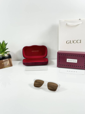 Guccii 2417 Ice Brown sunglasses with a translucent white frame and brown-tinted lenses