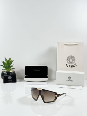 Versacs 134 Tiger Brown tortoiseshell shield sunglasses with brown gradient lenses and gold accents