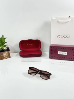 Guccii 0381 Brown square sunglasses with brown gradient lenses and gold-tone temple detailing